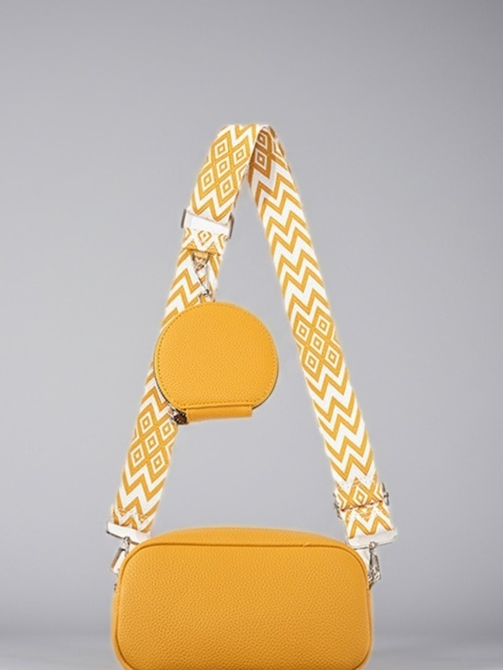 Yellow Crossbody Bag with Patterned Strap and Coin Pouch